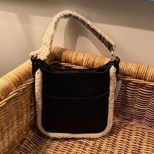 NWT Ahdorned Sherpa Messenger Bag with Adjustable Strap. Black/Cream